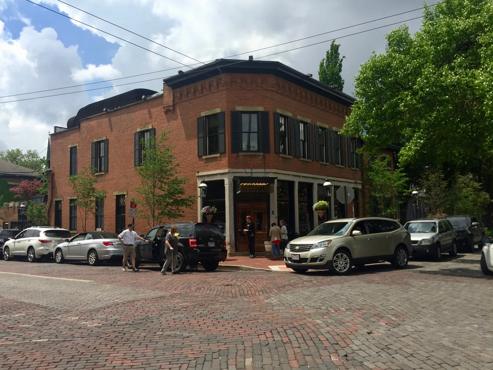 Historic red-brick building and brick-paved E Beck Street in German Village, Columbus, Ohio